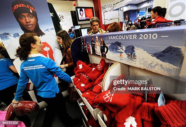 Canadian fans buy Team Canada Winter Olympic gloves at the Hudson's Bay department store in downtown Vancouver on February 7, 2010. Winter Olympics...