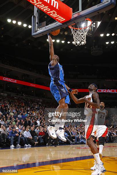 Josh Howard of the Dallas Mavericks lays the ball up against Anthony Morrow of the Golden State Warriors on February 8, 2010 at Oracle Arena in...