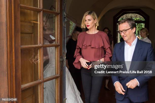 Charlize Theron and Thaddaeus Ropac attend the Thaddaeus Ropac's brunch during the amfAR EpicRide to Life Ball at Villa Emslieb on June 1, 2018 in...