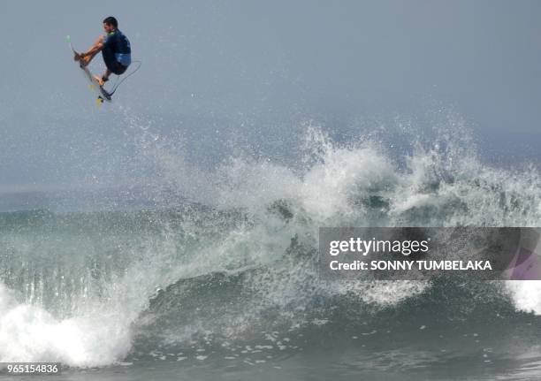 Brazil's Adriano De Souza competes during the 2018 World Surf League Men's Championship Tour at Keramas in Gianyar regency on Indonesia's resort...