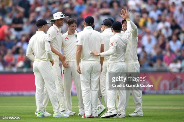 Chris Woakes of England celebrates with teammates after dismissing Haris Sohail of Pakistan during the 2nd NatWest Test match between England and...