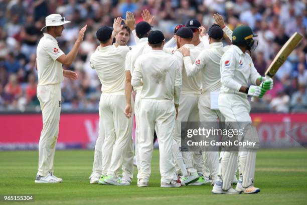 Chris Woakes of England celebrates with teammates after dismissing Haris Sohail of Pakistan during the 2nd NatWest Test match between England and...