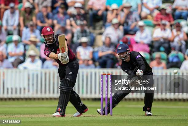 Gareth Roderick of Gloustershire looks on as James Hildreth of Somerset hits out during the Royal London One-Day Cup match between Somerset and...