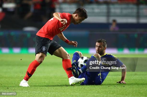 Hwang Hee-Chan of South Korea competes for the ball with Miralem Pjanic of Bosnia & Herzegovina during the international friendly match between South...