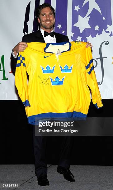 New York Rangers goaltender Henrik Lundqvist auctioning off a 2010 Team Sweden Olympic Jersey signed by him during casino night to benefit the Garden...