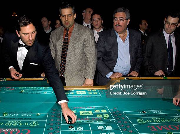 New York Rangers goaltender Henrik Lundqvist playing craps with guests during casino night to benefit the Garden Of Dreams Foundation at Gotham Hall...