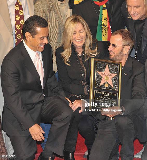 Los Angeles Mayor Antonio Villaraigosa, wife of Ringo Starr, Barbara Bach and musician Ringo Starr pose as he is honored with a Star on the Hollywood...