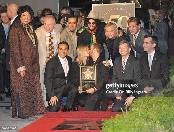 Barbara Bach and her husband, musician Ringo Starr pose as he is honored with a Star on the Hollywood Walk of Fame on February 8, 2010 in Hollywood,...