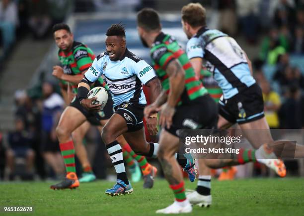 James Segeyaro of the Sharks makes a break during the round 13 NRL match between the South Sydney Rabbitohs and the Cronulla Sharks at ANZ Stadium on...