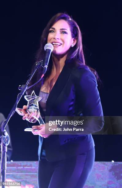 Carmen Dominicci receives award at Premios Estrellas Digitales 2018 at James L. Knight Center on May 31, 2018 in Miami, Florida.