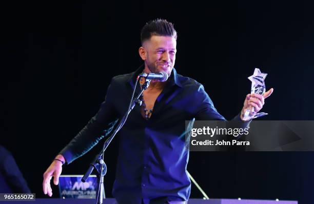 Omar Gonzalez receives award at Premios Estrellas Digitales 2018 at James L. Knight Center on May 31, 2018 in Miami, Florida.