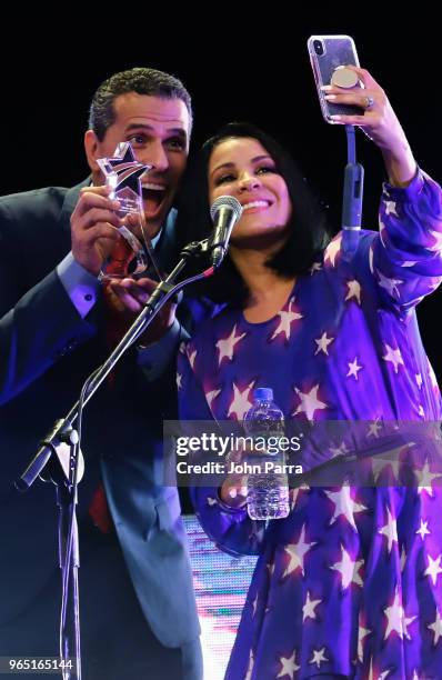 Marco Antonio Regil and Carolina Sandoval receive award at Premios Estrellas Digitales 2018 at James L. Knight Center on May 31, 2018 in Miami,...