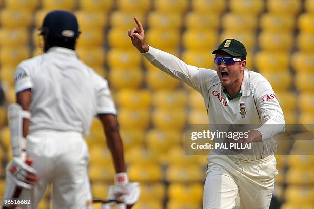 South African cricket captain Graeme Smith celebrates the dismissal of Indian batsman Subramaniam Badrinath on the fourth day of the first Test match...