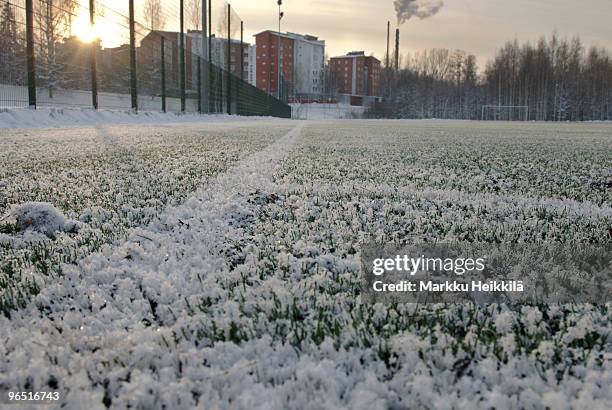 snow on football pitch - jyväskylä stock-fotos und bilder