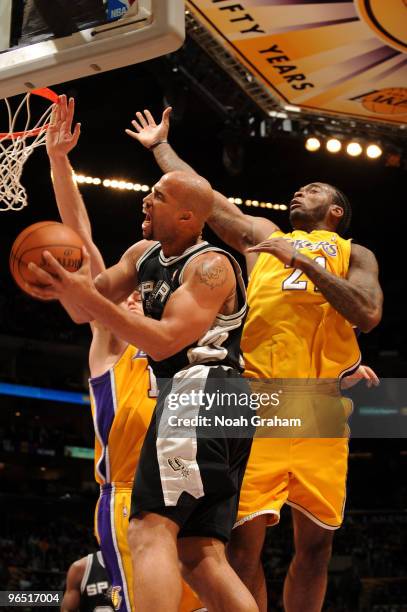 Richard Jefferson of the San Antonio Spurs has his shot challenged by Josh Powell of the Los Angeles Lakers at Staples Center on February 8, 2010 in...