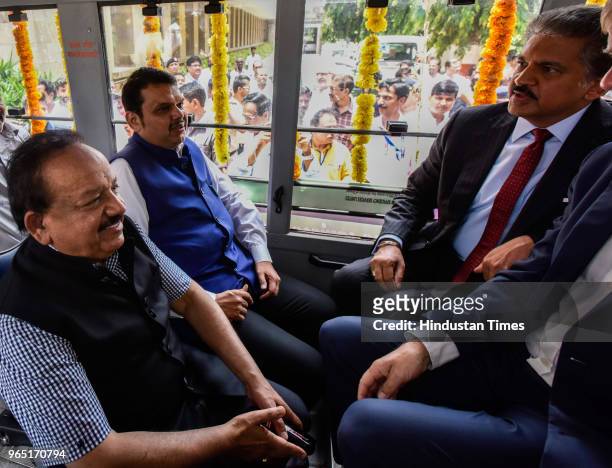 Chief Minister of Maharashtra Devendra Fadnavis along with State Minister of Health Harsh Vardhan and Entrepreneur Anand Mahindra travelling in...