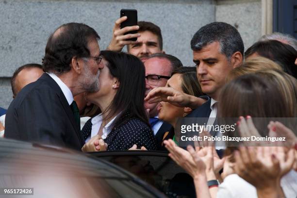 Spanish Prime Minister Mariano Rajoy gets the support of a party members after losing the no-confidence motion at the Lower House of the Spanish...