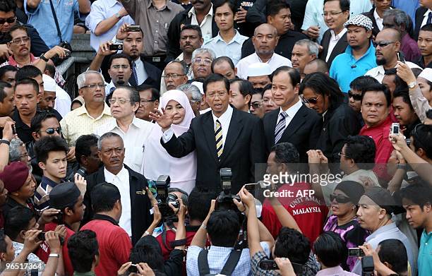 Former chief minister of Perak Mohammad Nizar Jamaluddin addresses his supporters outside his supporters outside the Federal Court in Putrajaya,...