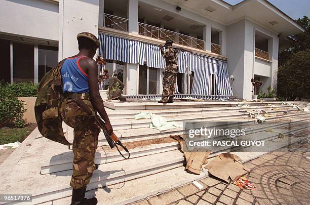 Soldier of Laurent-Desire Kabila's rebel troops of the Alliance of Democratic Forces for the Liberation of Congo-Zaire, walks towards the house of...