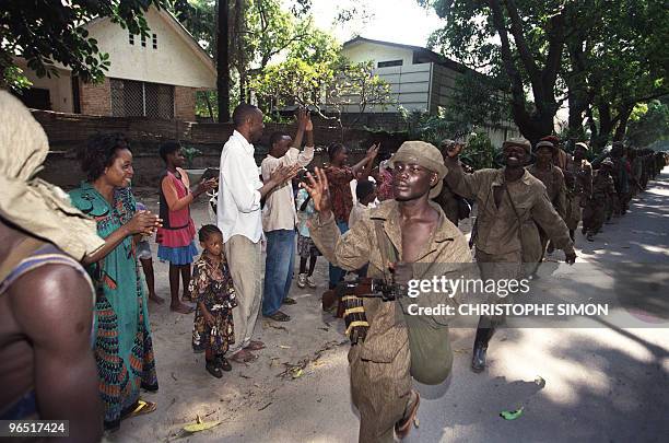 Laurent Desire Kabila's Alliance rebel troops are cheered upon their arrival in central Kinshasa 18 May 1997. Downtown Kinshasa celebrated 18 May...