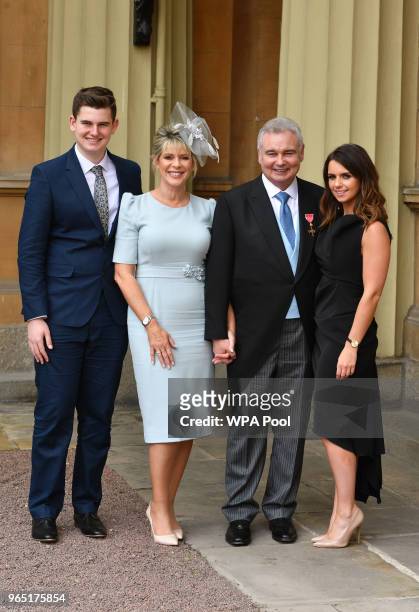 Eamonn Holmes, with his wife Ruth Langsford and his son Jack and daughter Rebecca , as he wears his OBE after it was awarded to him by Queen...