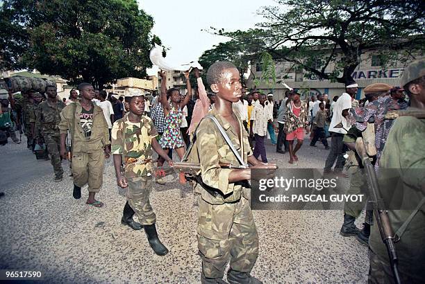 Kinshasa inhabitants greet Laurent Desire Kabila's Alliance rebel troops entering the city, 17 May 1997. Downtown Kinshasa celebrated 18 May 1997 as...
