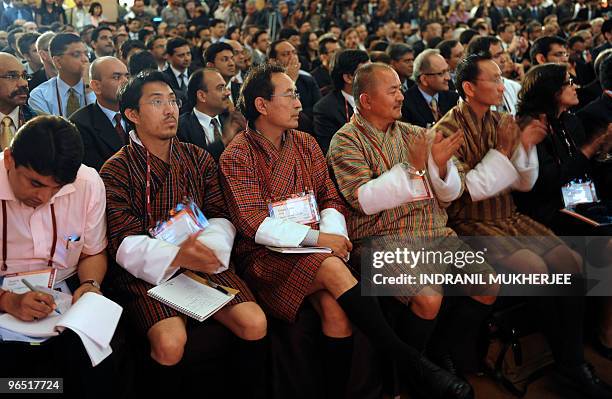 Bhutanese delegates applaude an unseen speaker during the inaugural session of the National Association for Software and Services Companies India...