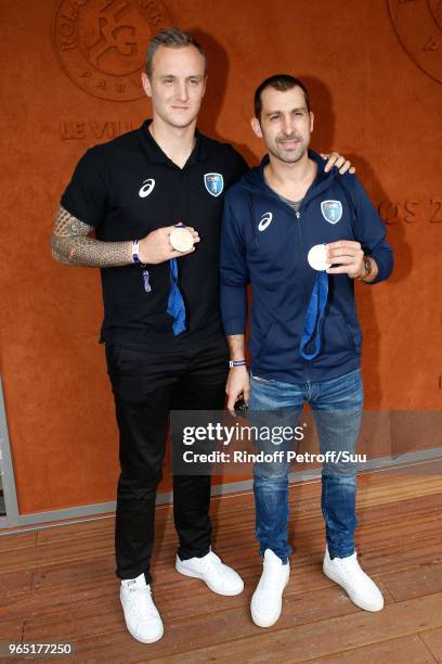 Handball players Valentin Porte and Michael Guigou attend the 2018 French Open - Day Six at Roland Garros on June 1, 2018 in Paris, France.