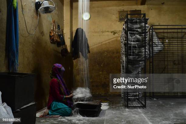 An Indian woman worker prepares vermicelli,a traditional sweet dish ,in a factory , ahead of Eid Al Fitr festival , in the old streets of Allahabad...