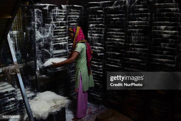 An Indian woman worker prepares vermicelli,a traditional sweet dish ,in a factory , ahead of Eid Al Fitr festival , in the old streets of Allahabad...