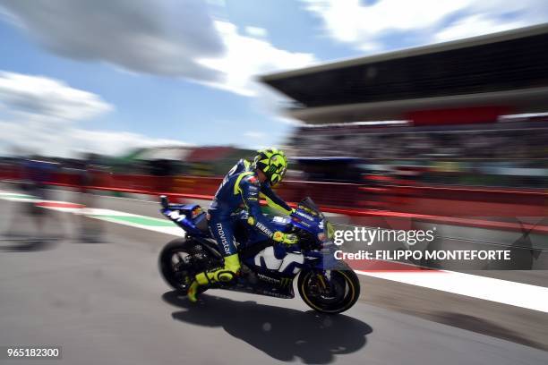 Movistar Yamaha MotoGP's Italian rider Valentino Rossi exits the pit lane during a free practice session ahead of the Italian Moto GP Grand Prix at...