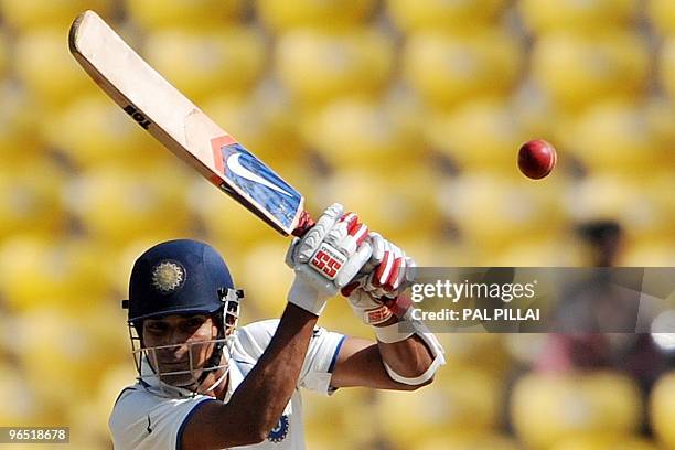 Indian cricketer Subramaniam Badrinath plays a shot on the third day of the first cricket Test match between India and South Africa in Nagpur on...