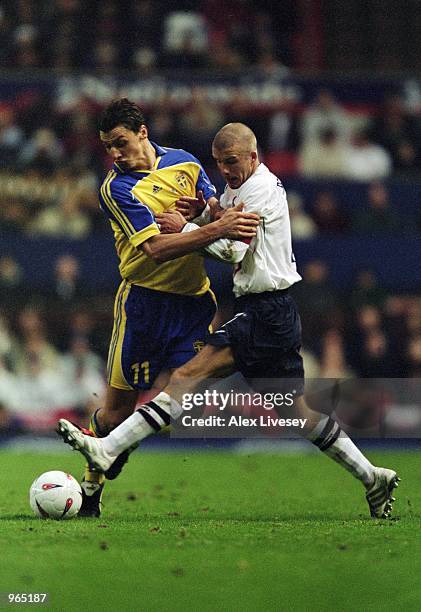 David Beckham of England challenges for the ball with Zlatan Ibrahimovic of Sweden during the International Friendly match between England and Sweden...