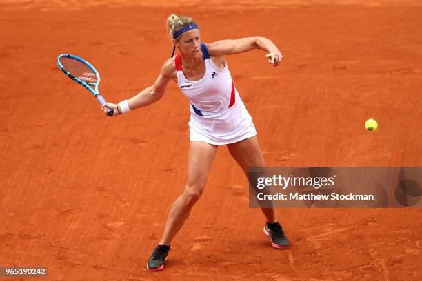 Pauline Parmentier of France plays a forehand during her ladies singles third round match against Caroline Wozniacki of Denmark during day six of the...