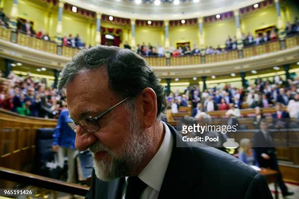 Former Prime Minister Mariano Rajoy leaves parliament after Sanchez won the no-confidence motion at the Lower House of the Spanish Parliament on June...