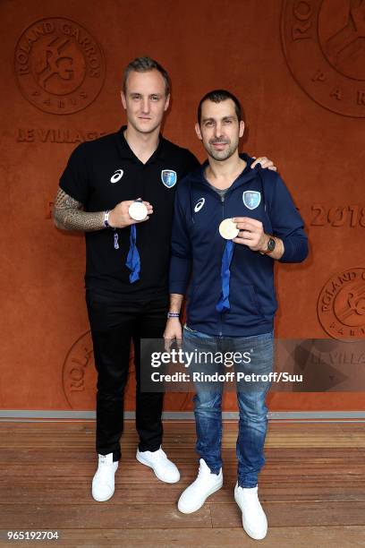 Handball players Valentin Porte and Michael Guigou attend the 2018 French Open - Day Six at Roland Garros on June 1, 2018 in Paris, France.