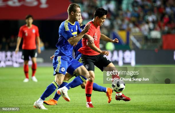 Ju Se-Jong of South Korea competes for the ball with Stjepan Loncar of Bosnia & Herzegovina during the international friendly match between South...