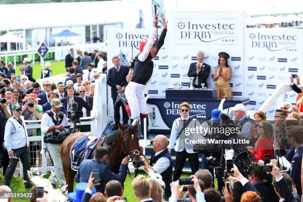 Frankie Dettori riding Cracksman celebrates winning the Investec Coronation Cup during Ladies Day of the Investec Derby Festival at Epsom Downs on...