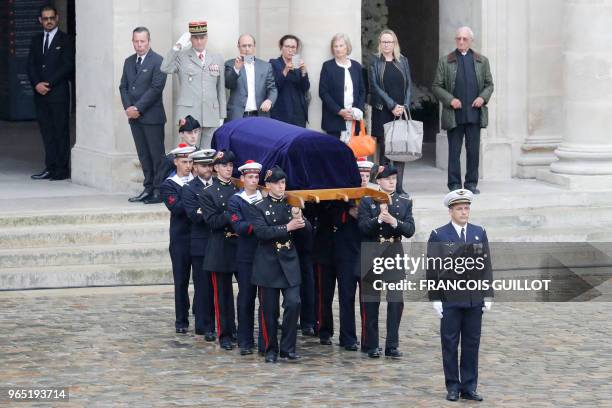 French soldiers carry the coffin of late French industrialist-turned-politician Serge Dassault in the Hotel des Invalides courtyard on June 1, 2018...