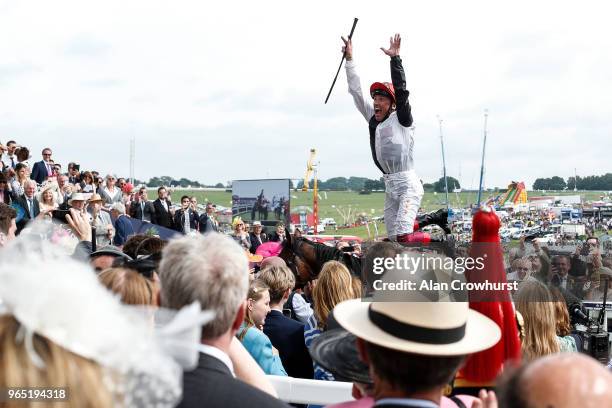 Frankie Dettori celebrates after riding Cracksman to win The Investec Coronation Cup during the Investec Ladies Day at Epsom Downs Racecourse on June...