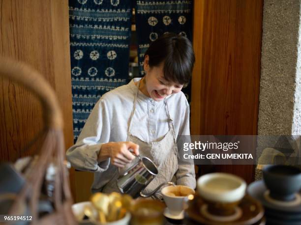 women working at a cafe - only japanese stock pictures, royalty-free photos & images