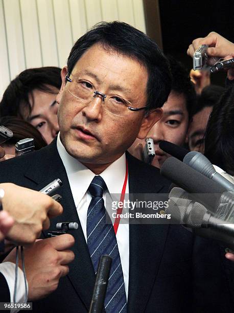 Akio Toyoda, president of Toyota Motor Corp., is surrounded by journlists after meeting with Seiji Maehara, Japan's minister for land and transport,...