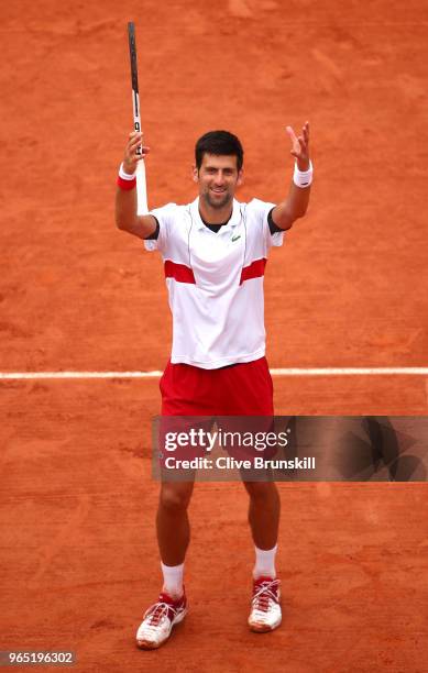 Novak Djokovic of Serbia celebrates victory durng his mens singles third round match against Roberto Bautista Agut of Spain during day six of the...