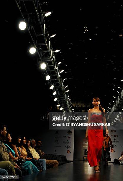 An Indian model walks the ramp as she presents a creation of designer Amita Sharma during the first day of the Bangalore Fashion Week in Bangalore on...