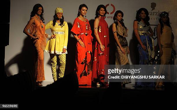 An Indian model walks the ramp as she presents a creation of designer Vipin Batra during the first day of the Bangalore Fashion Week in Bangalore on...