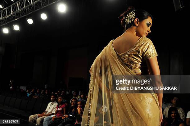 An Indian model presents a creation from the designer Arshi Jamal, during the first day of the Bangalore Fashion Week in Bangalore on January 28,...