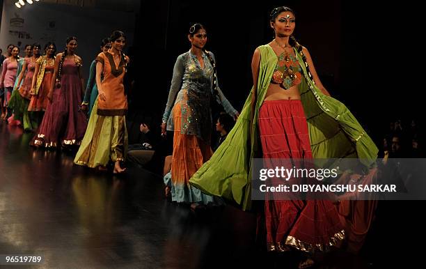 Indian models present the creations of designer Ishita Singh, during the first day of the Bangalore Fashion Week in Bangalore on January 28, 2010. A...