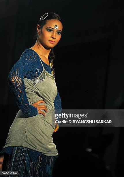 Indian models present the creations of designer Ishita Singh, during the first day of the Bangalore Fashion Week in Bangalore on January 28, 2010. A...
