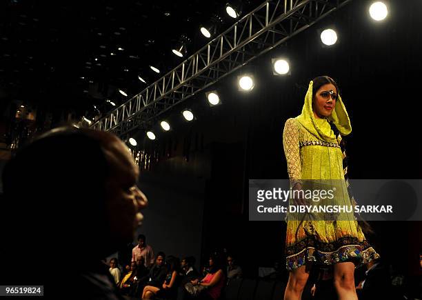 Indian models present the creations of designer Ishita Singh, during the first day of the Bangalore Fashion Week in Bangalore on January 28, 2010. A...