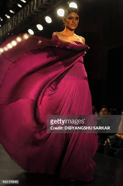 An Indian model presents a creation of designer Swapnil Shinde, during the first day of the Bangalore Fashion Week in Bangalore on January 28, 2010....